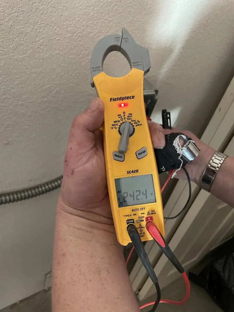 Voltage testing with clamp meter during Generator Installation in Pleasant Valley